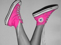 Pink High Top and Low Cut Chucks  Wearing neon pink high top chucks, left side view.