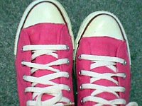 Pink High Top and Low Cut Chucks  Neon pink high tops, top view.