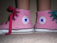 Pink High Top and Low Cut Chucks  Wearing pink high top chucks with red and green fat laces, inside patch views.
