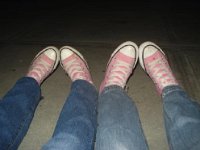 Pink High Top and Low Cut Chucks  Side by side wearing pink high top chucks.
