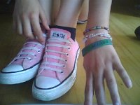 Pink High Top and Low Cut Chucks  Wearoing pink low cut chucks with straight laces.