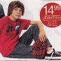 Chucks Worn By Prre-Teen Boys and Girls in Ads  Seated boy wearing black low top chucks.
