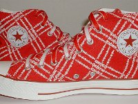 Product Red High Top Chucks  Inside patch views of Product Red high tops with red and white reversible shoelaces.