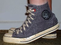 The Ramones High Top Chucks  Stepping up in a pair of Ramone's high tops with hemp laces, left side view.