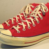 Red Chuck 70 Vintage Canvas High Tops  Angled side view of red Chuck 70 vintage canvas high tops.
