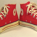 Red Chuck 70 Vintage Canvas High Tops  Angled front view of red Chuck 70 vintage canvas high tops.