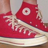Red Chuck 70 Vintage Canvas High Tops  Wearing red Chuck 70 vintage canvas high tops, right side view 2.