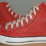 Red High Top Chucks  Distressed red high tops, outside view.