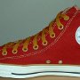 Red High Top Chucks  Inside patch view of a right red and gold foldover high top with gold laces.
