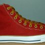 Red High Top Chucks  Outside view of a right red and gold foldover high top with gold laces.