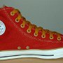 Red High Top Chucks  Inside patch view of a left red and gold foldover high top with gold laces.
