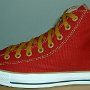Red High Top Chucks  Outside view of a left red and gold foldover high top chuck.