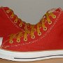 Red High Top Chucks  Outside views of red and gold foldover high tops with gold laces.