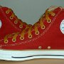 Red High Top Chucks  Inside patch views of red and gold foldover high tops with gold laces.