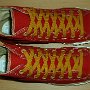 Red High Top Chucks  Top view of red and gold foldover high tops with gold laces.