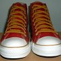 Red High Top Chucks  Front view of red and gold foldover high tops with gold laces.