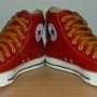 Red High Top Chucks  Angled front view of red and gold foldover high tops with gold laces.