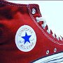 Red High Top Chucks  Closeup of a new left red high top showing the ankle patch.