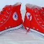 Red High Top Chucks  Made in USA red high tops with red laces, angled front and inside patch views.