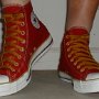 Red High Top Chucks  Wearing red and gold foldover chucks, front view.