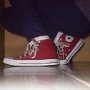 Red High Top Chucks  Kneeling down in a pair of red high top chucks.