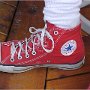 Red High Top Chucks  Wearing red high tops, right side view.