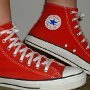 Red High Top Chucks  Wearing red high top chucks, right side view.