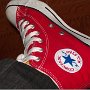 Red High Top Chucks  Wearing a left red high top chuck, inside patch view.