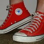 Red High Top Chucks  Wearing made in USA red high tops, left side view.