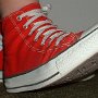 Red High Top Chucks  Wearing made in USA red high tops, right side view.