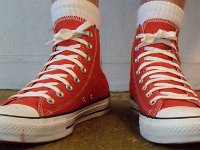 Red Clay High Top Chucks  Wearing red clay high top chucks, front view 1.