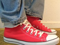 Red Foldover Double Upper High Top Chucks  Wearing rolled down red and white foldover double upper high top chucks with Levis, right side view.