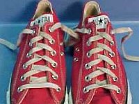 Red Low Cut Chucks  Worn red low cuts, top view.