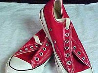 Red Low Cut Chucks  New unlaced vintage red low cuts, top view.