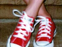 Red Low Cut Chucks  Wearing red low cut chucks, front view.