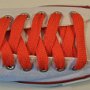 Orange Retro Shoelaces  Optical white low top chuck with orange retro shoelaces.