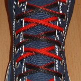 Reversible Shoelaces On Chucks  Navy blue high top with black and red reversable laces.