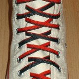 Reversible Shoelaces On Chucks  Natural white high top with black and red reversable laces.