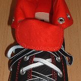 Reversible Shoelaces On Chucks  Black and red rolldown high top with black and white reversable laces.