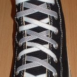 Reversible Shoelaces On Chucks  Black high top with gray and white reversable laces.