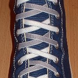 Reversible Shoelaces On Chucks  Navy blue high top with gray and white reversable laces.