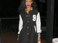 Rihanna  Rihanna walking in black high top chucks.
