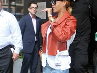Rihanna  Rihanna wearing black high top chucks.