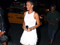 Rihanna  Rihanna entering an event wearing black high top chucks.