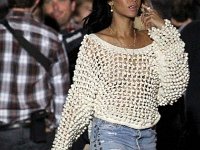 Rihanna  Rihanna wearing unbleached white high top chucks.