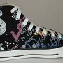 Rock and Roll High Top Chucks  Inside patch view of a left black punk print high top.