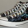 Rock and Roll High Top Chucks  Angled side view of black punk print high tops.