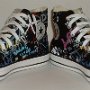 Rock and Roll High Top Chucks  Angled inside patch views of black punk print high tops.