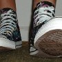 Rock and Roll High Top Chucks  Wearing black punk print high tops, front view 2.