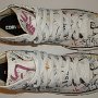 Rock and Roll High Top Chucks  Top view of white punk print high tops.